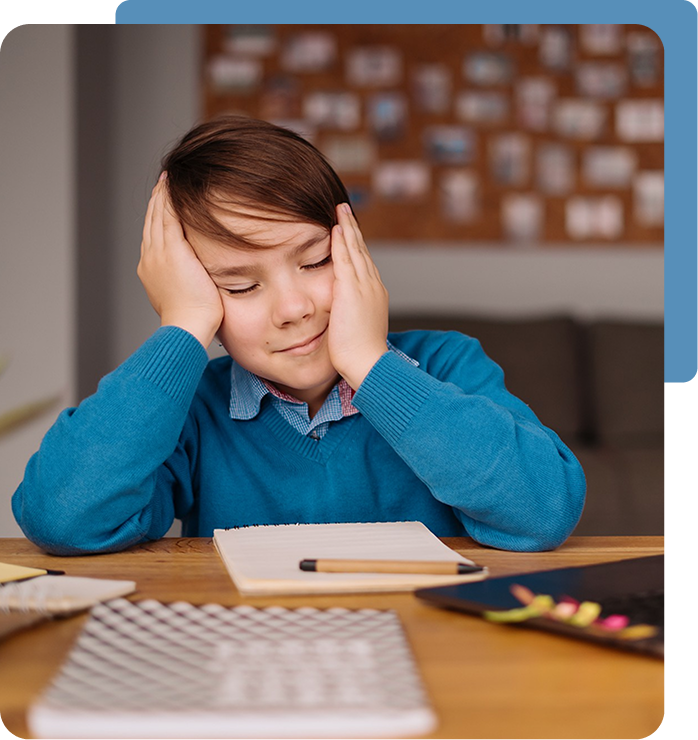 Child struggling with focus during homework, representing the need for ADHD Treatment in Valencia, Calabasas & Lancaster, CA