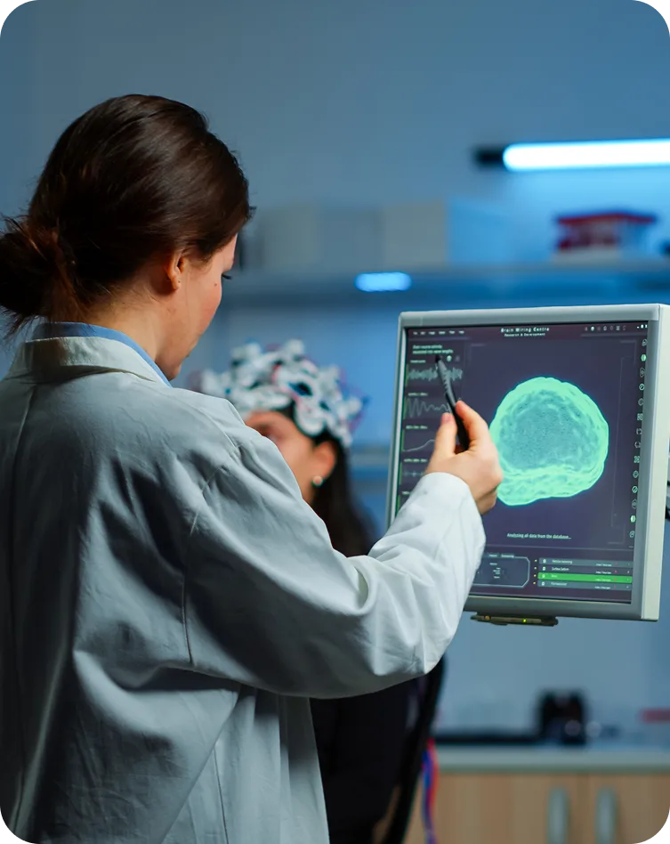 a therapist analyzing brain patterns during TMS Therapy in Valencia, Calabasas & Lancaster, CA